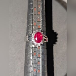 Silvertone, tarnish proof Size 7 ring. Lab created diamonds and emerald